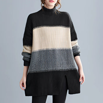 Oversized turtleneck striped sweater dress in chunky knit fabric, featuring long sleeves and a cozy fit ideal for winter fashion.