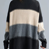 Oversized turtleneck striped sweater dress in chunky knit fabric, featuring black and white stripes with long sleeves, perfect for winter fashion.