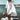 Oversized white beach shirt tunic for women in 5XL, featuring a lightweight and breezy design ideal for summer, worn by a person standing happily by a serene lake under a clear sky.