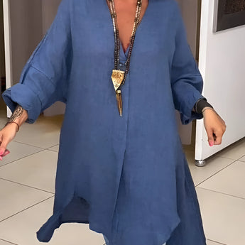 Oversized white linen blouse with long sleeves and a relaxed fit, designed in a casual chic bohemian style, suitable for summer wear.