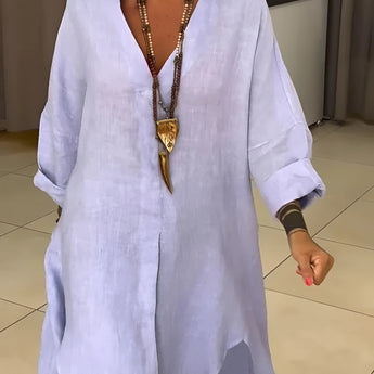 Oversized white linen blouse featuring a casual chic bohemian style, designed as a summer top in a 3XL size. The blouse has long sleeves, a collar, and a relaxed fit, perfect for a fashionable and comfortable look.