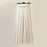 Oversized white turtleneck sweater hanging on a wooden clothes hanger, showcasing its cozy ribbed knit texture and winter-ready design.
