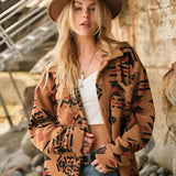 Oversized women's Aztec jacket in a boho tribal pattern, featuring a stylish design with a focus on outerwear fashion. The image includes a human model wearing a hat, showcasing the jacket's fit and style.