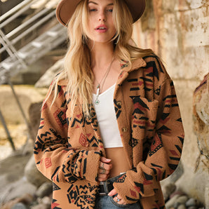 Oversized women's Aztec jacket in a boho tribal pattern, featuring a stylish design with a focus on outerwear fashion. The image includes a human model wearing a hat, showcasing the jacket's fit and style.
