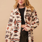 Oversized women's Aztec jacket in brown, featuring a boho tribal pattern, with a collar and long sleeves, designed for a relaxed fit, shown in size XL.