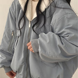 Oversized women's gray bomber puffer jacket in size 2XL, featuring a large collar, long sleeves, and a stylish waist-length design, perfect for trendy winter fashion.