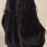 Oversized women's black bomber puffer jacket designed for trendy winter fashion, featuring a stylish silhouette with long sleeves and a high collar.