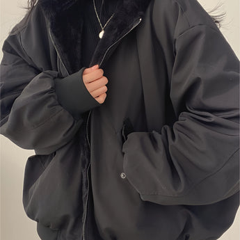 Oversized women's black bomber puffer jacket in a 2XL size, featuring a high collar, long sleeves, and a trendy winter fashion design. The jacket has a sleek and modern look, perfect for cold weather.