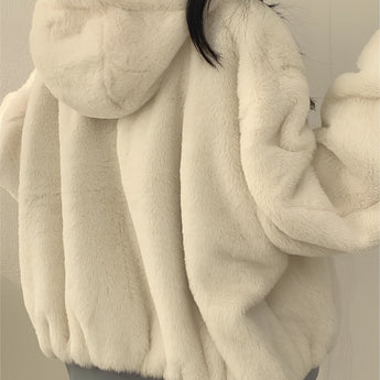 Oversized women's black bomber puffer jacket with a warm, trendy design, featuring a comfortable fit and long sleeves.