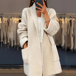 Oversized women's chunky knit cardigan in beige and white, featuring a cozy, textured design with long sleeves and a relaxed fit, perfect for winter fashion.