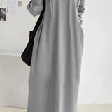 Oversized women's long gray hoodie dress made from a comfortable cotton blend, featuring long sleeves and a relaxed fit suitable for casual fashion wear.