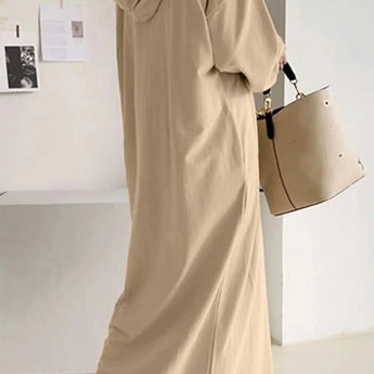 Oversized women's long gray hoodie dress made from a comfortable cotton blend, featuring a relaxed fit with long sleeves and a hood, displayed on a clothes hanger.