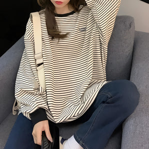 Oversized Women's Striped Hoodie in persimmon color, casual long sleeve top, worn by a model with long hair, showcasing the 2XL size.