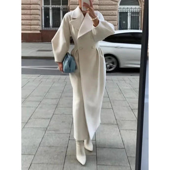 Oversized women's white wool trench coat in 2XL size, featuring a double-breasted design with long sleeves. The coat exudes elegance and is perfect for winter formal wear.