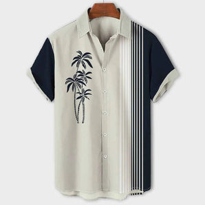 Navy blue men's shirt with contrast sleeves featuring a tropical palm tree print, in size 3XL.