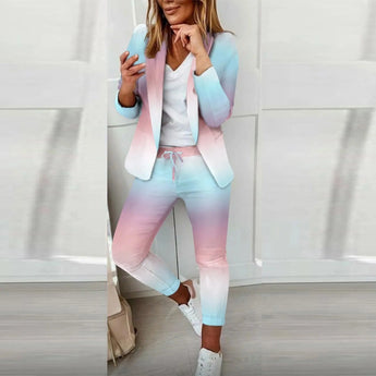 Pastel women's casual suit featuring a blazer and ombre joggers in a chic Azzurro color. The suit is designed for a relaxed fit with a comfortable waist, long sleeves, and a stylish neck. The joggers have a soft pastel gradient with a focus on the thigh and knee areas, ideal for casual urban fashion. Size 2XL.