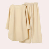 Pastel yellow linen loungewear set for women featuring a short-sleeved top with collar and matching shorts, designed for comfort and style.