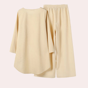 Pastel yellow linen loungewear set for women featuring a short-sleeved top with collar and matching shorts, designed for comfort and style.