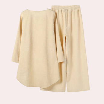 Pastel yellow linen loungewear set for women featuring a short-sleeved top with collar and matching shorts, designed for comfort and style.