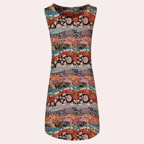 Sleeveless boho dress featuring a vibrant patchwork floral pattern in shades of magenta and peach, perfect for summer festival wear.
