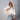 Peach lace blouse and acid wash jeans ensemble with white sneakers, accessorized with sunglasses. The outfit is styled for a chic summer look, displayed in the beige variant, size XL.