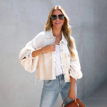 Peach lace blouse and acid wash jeans ensemble with white sneakers, accessorized with sunglasses. The outfit is styled for a chic summer look, displayed in the beige variant, size XL.