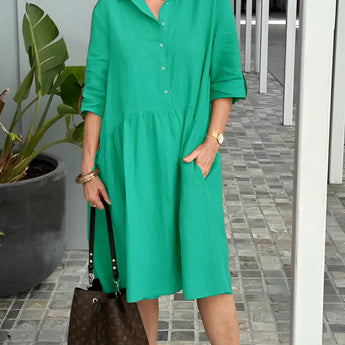 
Woman wearing a green mid-length spring dress with a casual and elegant style, suitable for warm weather; the dress is lightweight and designed for comfort.