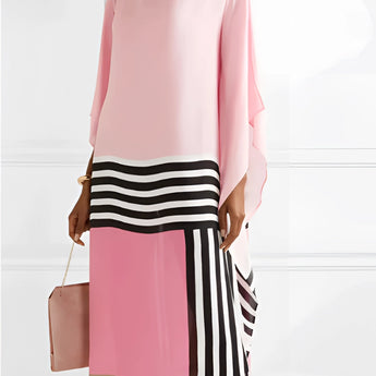 Pink asymmetrical stripe maxi dress in bold multicolor chic design, featuring a fitted waist, long sleeves, and a stylish neckline, suitable for daytime wear; available in size 2XL.