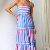 Pink and blue striped maxi dress with spaghetti straps, designed as a summer beach dress.