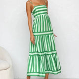 Pink and blue striped maxi dress with spaghetti straps, designed for a summer beach setting; the dress features a flowing one-piece silhouette with emphasis on the shoulder, neck, and waist areas.