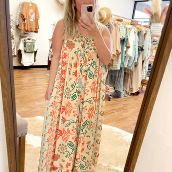 Pink floral bohemian wide-leg jumpsuit with pockets, featuring a yellow color scheme, suitable for formal and casual occasions, in 4XL/5XL size. The jumpsuit includes a relaxed fit with a defined waist and stylish wide sleeves.