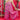 Pink floral bohemian wide-leg jumpsuit with pockets, featuring a vibrant pink floral pattern, loose wide-leg fit, and comfortable waist, worn by a smiling woman with long sleeves, showcasing a relaxed and stylish bohemian vibe.