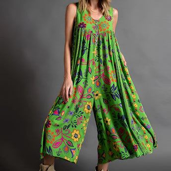 Pink floral bohemian wide-leg jumpsuit with pockets, featuring a relaxed fit, short sleeves, and a comfortable waist, ideal for casual wear or a day out.