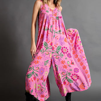 Pink floral bohemian wide-leg jumpsuit with pockets, featuring flowing sleeves and a relaxed fit, shown in 4XL/5XL size.