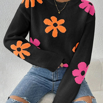 Pink floral lightweight knit sweater featuring a red flower pattern, shown in Nero color variant, size XL. The sweater has long sleeves, a round neck, and is paired with blue jeans.