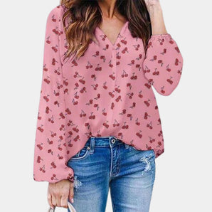 Pink floral V-neck blouse with long sleeves, designed for office wear. The blouse is in a rose color and size 2XL, featuring a chic and stylish look suitable for professional settings.