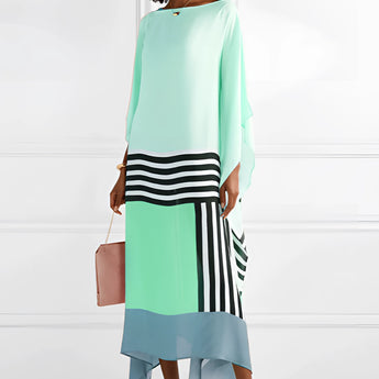 Blue geometric cape dress with long sleeves, featuring an asymmetrical design suitable for evening wear.