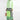 Green geometric cape dress with long sleeves and an asymmetric design, featuring a structured shoulder, fitted waist, and knee-length hem.