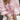 Pink gingham puff sleeve blouse with ruffle trim, showcasing close-up details of the fabric and sleeve design against a white background.