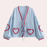 Pink gingham puff sleeve blouse with ruffle trim, showcasing a classic collar and button details, in a vibrant blue color, size XL.