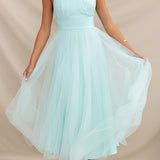 Green halter neck backless tulle dress designed for weddings and summer events, showcasing elegant shoulder and neck details, available in XL size.