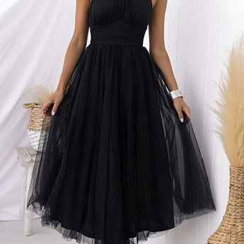 Pink halter neck backless tulle dress with flowing fabric, showcasing a fitted waist and sleeveless design, ideal for weddings and summer events.