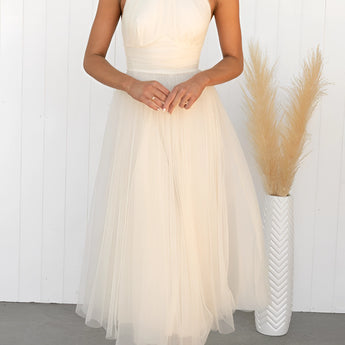 Pink halter neck backless tulle dress suitable for weddings and summer events, shown in cream color and XL size, featuring a flowing one-piece design with an elegant neckline and sleeveless style.