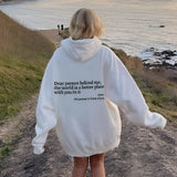 Pink tie-dye hoodie featuring an inspirational self-love quote, shown on a person enjoying a sunny beach landscape with sand and grass, wearing a 3XL size.