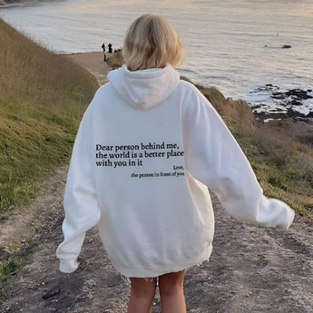 Pink tie-dye hoodie featuring an inspirational self-love quote, shown on a person enjoying a sunny beach landscape with sand and grass, wearing a 3XL size.