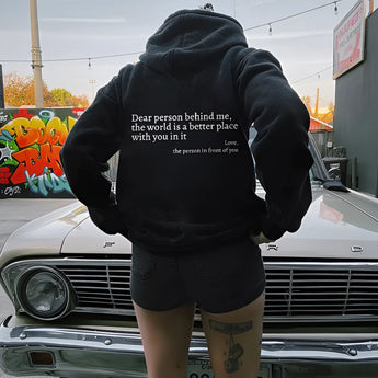 Pink tie-dye hoodie with a self-love inspirational quote, displayed on the hood of a white vehicle in an outdoor setting.