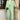 Women's pink trouser suit set including a blazer, high-waist pants, and a crop top, displayed on a white background.