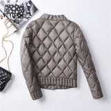 Pink women's quilted jacket with a diamond pattern, featuring long sleeves and a collar.