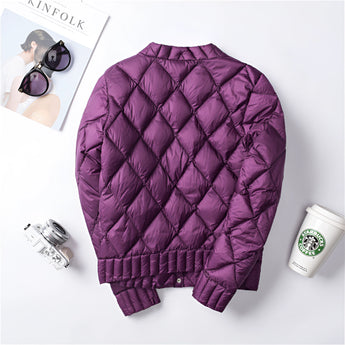 Pink women's quilted jacket with a diamond pattern, featuring lightweight material and long sleeves, displayed against a plain background.