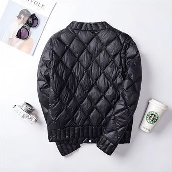 A pink women's lightweight quilted jacket featuring a diamond pattern design, displayed with a focus on the sleeve detail.